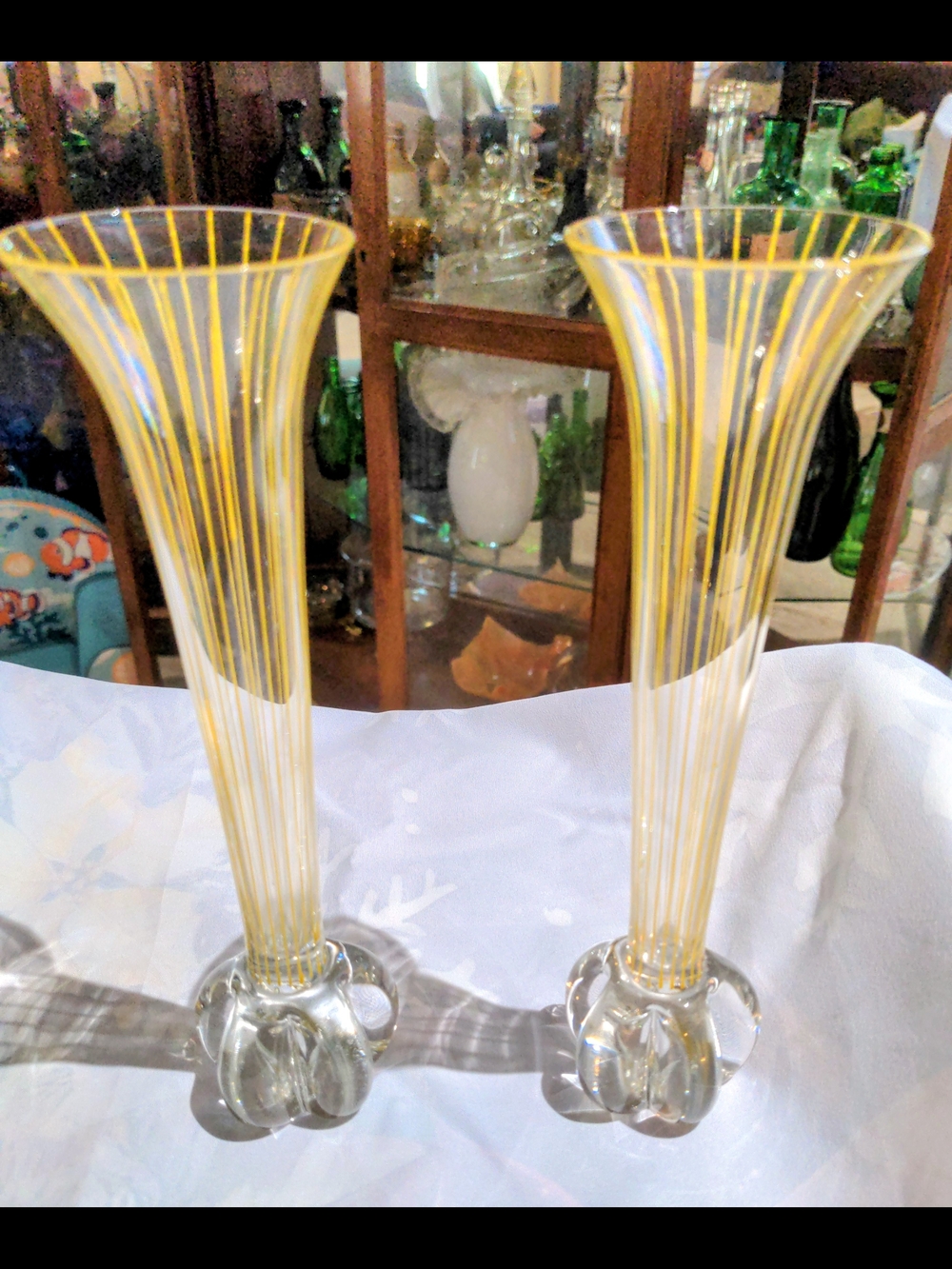 Pair of mid-century studio art glass vases with yellow stripes and ribbed bases.